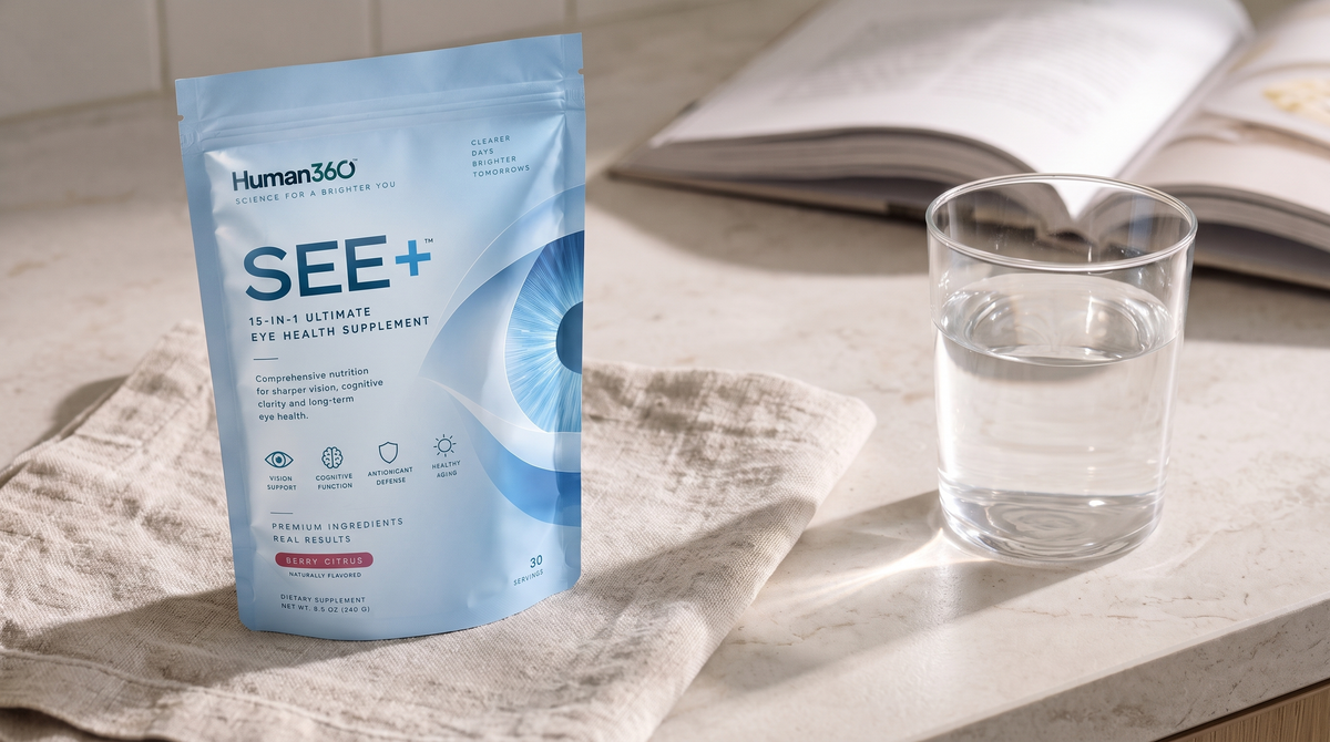 Human360 SEE+ pouch next to a glass of water and an open book