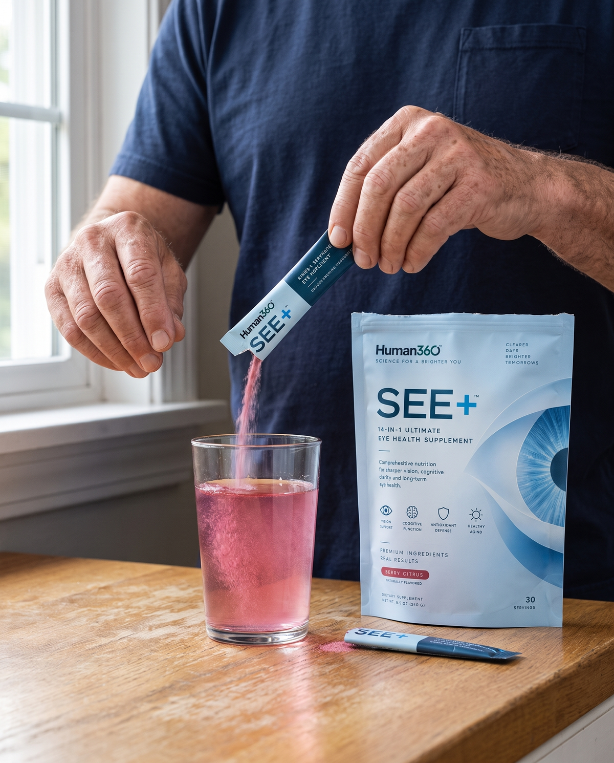 Illustrative photograph of one SEE+ sachet being mixed into water.