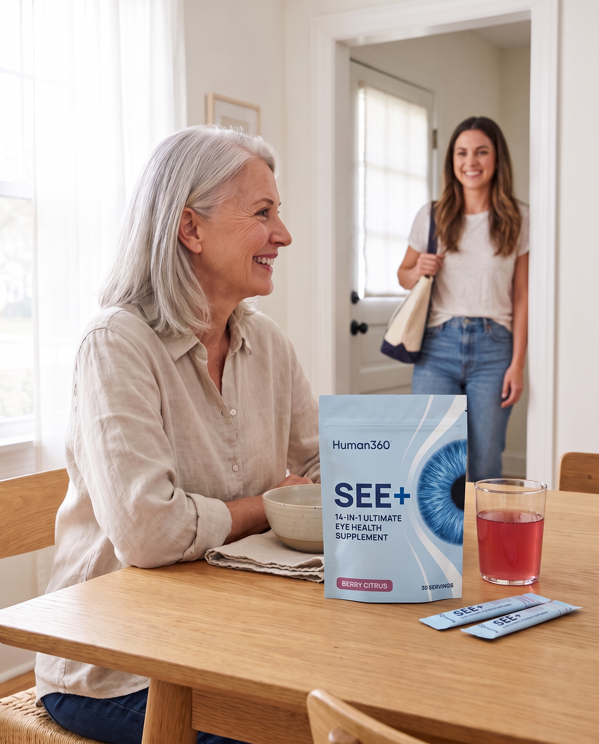 Illustrative photograph of a woman greeting her daughter with SEE+ on the table.