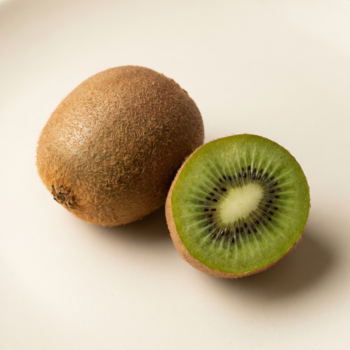 one whole kiwi and one freshly cut kiwi half with bright green flesh and tiny black seeds