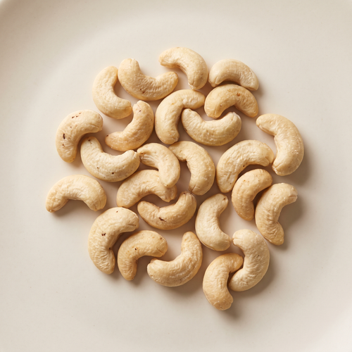 a small loose handful of curved raw cashew nuts